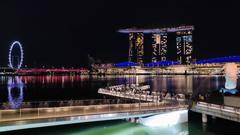 Marina Bay Singapore skyline with Singapore Flyer, Marina Bay Sands, and Merlion