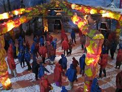 Snow World in Hyderabad with people snow dancing under colorful lights