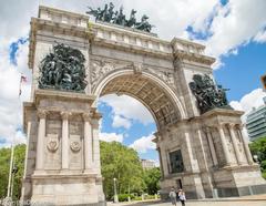 Historic Soldiers' and Sailors' Arch in Brooklyn with people and cars nearby