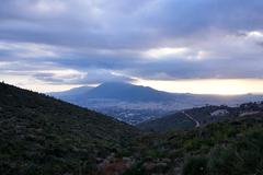 View of Mount Hymettus from Mount Pentelicus with Mount Lycabettus, the Acropolis, Philopappos Hill, and the sea of Piraeus in the distance