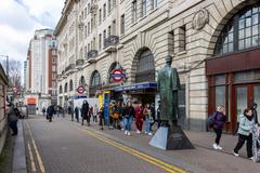 Busy street scene in London with significant pedestrian and vehicular traffic