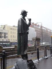 Snow-covered Sherlock Holmes statue outside Baker Street Underground Station