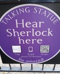 Public interactive plaque of Sherlock Holmes statue in London