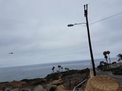 USCG Jayhawk helicopter over Sunset Cliffs