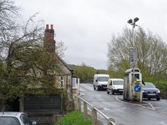 Cars crossing Swinford Toll Bridge