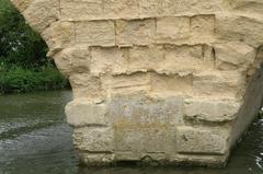 Swinford Toll Bridge pier with eroded stone on the River Thames