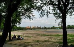 evening at Sanam Luang with Wat Phra Kaeo and Grand Palace in the background, Bangkok, Thailand