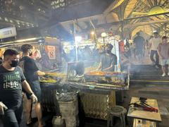 Lau Pa Sat market at night with lit lanterns and people