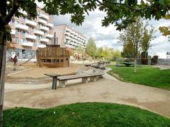 Grasbrookpark in HafenCity showing playground with wooden play structures and seating areas