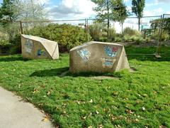 Large stones with mosaic at the edge of the park