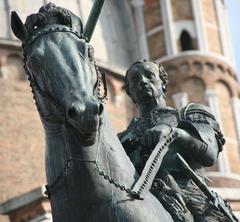 bronze statue of a man riding a horse