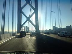 Bay Bridge WB I80 with cars driving under a cloudy sky