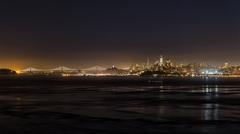 San Francisco cityscape at night with Bay Bridge