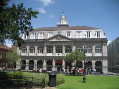 Front of the Cabildo building in Jackson Square, New Orleans, with a sousaphone in the foreground.