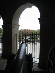 New Orleans Cabildo arcade view with cannon and busking musicians