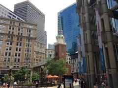 Old South Meeting House in downtown Boston surrounded by modern buildings