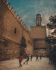 kids playing football next to Aqmar Mosque in Old Cairo