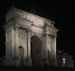 Arco della Pace monument illuminated at night in Italy