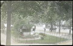 Last surviving stones of the Bastille prison, partially covered by foliage, located at the corner of Boulevard Henri IV and Quai de Celestins in Paris.