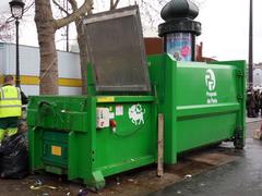 Electric compactor bin at Bastille market in Paris