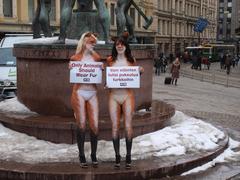 PETA activists painted as foxes protesting against fur trade in Helsinki