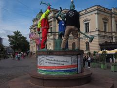 Three Smiths Statue in caretaker uniforms