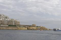 view of Valletta, Malta with domes and spires of historic buildings under a clear sky