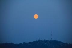 Full moon over Uetliberg towers