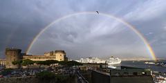 Castel Nuovo with a rainbow in Naples, Italy