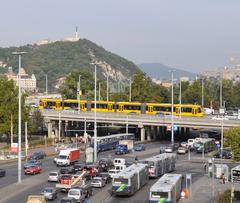 Combino tram on Boráros Square with Petöfi Bridge in Budapest