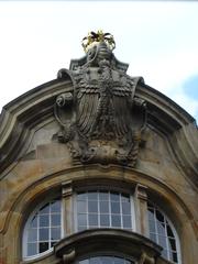 Coat of arms above the main portal of the northern Marstall at the Prince-Bishop's Residence Castle in Münster, Westphalia, Germany