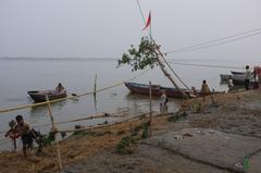 Ganges river in Varanasi with boats and historic buildings