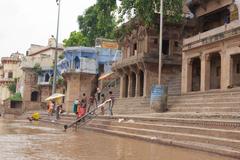 Ghats in Varanasi with boats along the river Ganges