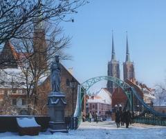 Most Tumski Bridge in Wrocław with Wrocław Cathedral towers in the background