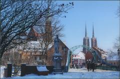 Most Tumski in Wrocław with Wrocław Cathedral towers in the background and Church of the Holy Cross tower on the left