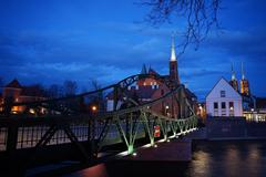 Tumski Bridge in Wrocław, Poland with padlocks attached to its railings