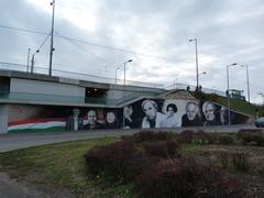 Graffiti mural at Rákóczi Bridge in Budapest featuring portraits of Hungarian actors