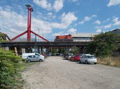 Red diesel locomotive on the Connective Railway Bridge in Ferencváros, Budapest