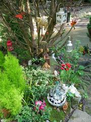 Buddhist and Hindu statues with offerings at Buddhapadipa Temple grounds