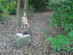 Buddhist and Hindu statuary assemblage with offerings at Buddhapadipa Temple, Wimbledon