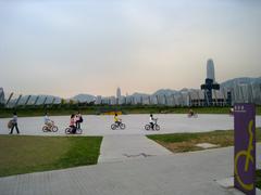 West Kowloon Waterfront Promenade with people cycling