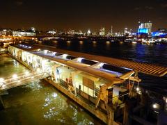 Embankment Pier with boats and London Eye in the background