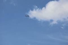 Aircraft flying over Westminster Pier in London