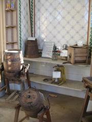 Inside Wimpole Dairy with an assortment of old farming implements