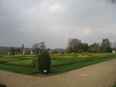 Formal garden created by the 2nd Earl of Radnor, designed by Royal London gardeners Wise and London, featuring neatly manicured hedges and pathways