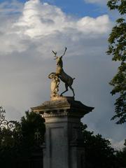 Entrance gates at Wimpole Hall with lion and deer statues