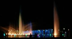 Wrocław multimedia fountain at night with colorful lights and water displays