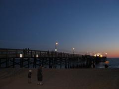 Balboa Pier at night with reflections in the water