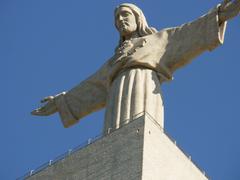 Cristo-Rei statue in Almada, Portugal with Lisbon cityscape view