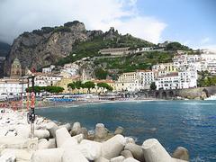 panoramic view of Amalfi with coastal buildings and hills